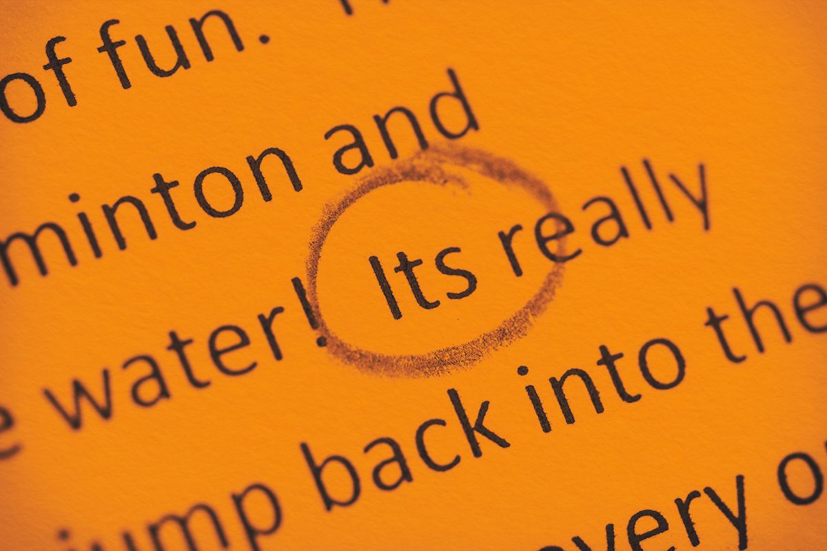 Close-up of a written contraction mistake