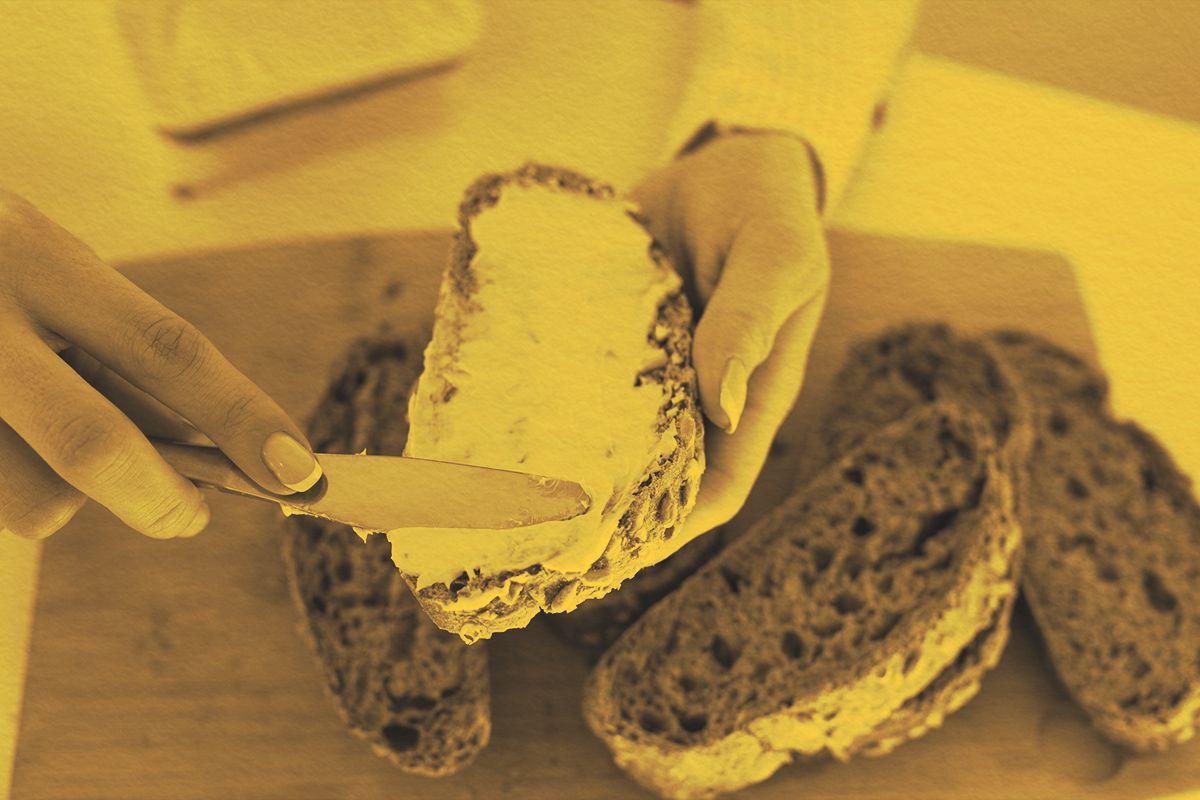 spreading butter on bread