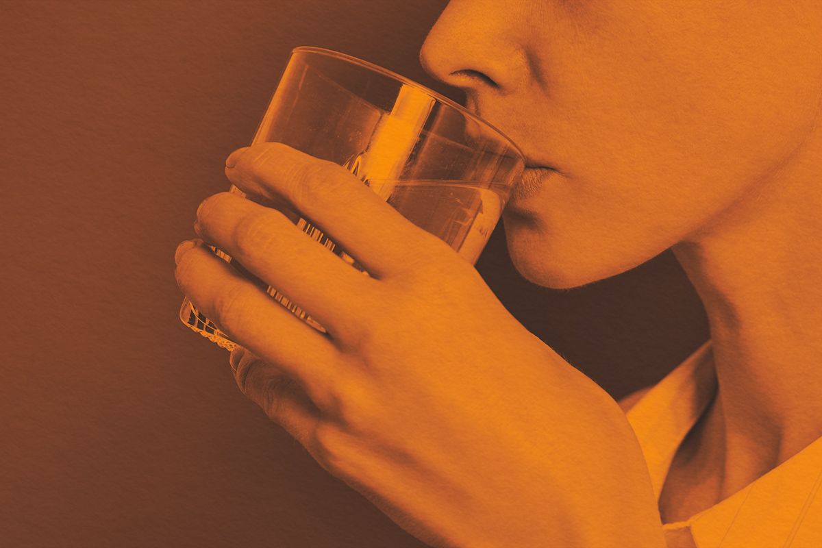 Close-up of a woman drinking water