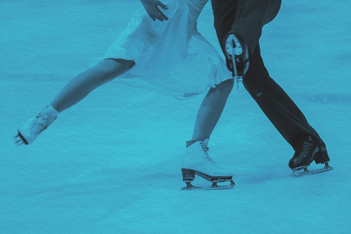 Figure skaters competing on ice