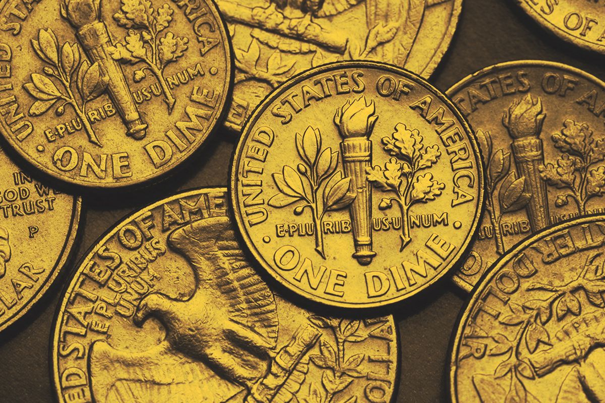 Torch, oak branch and olive branch depicted on the US dime coin