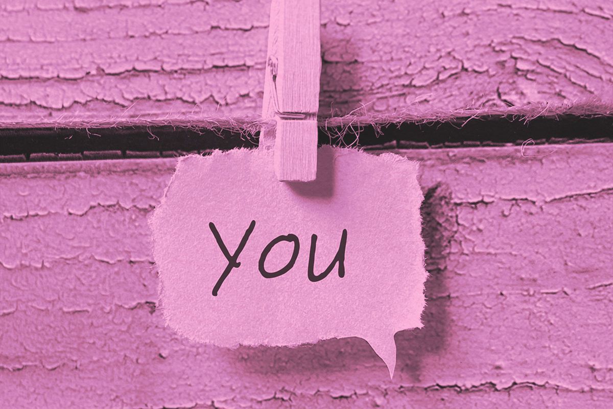 You written on scrap paper and clipped on a string