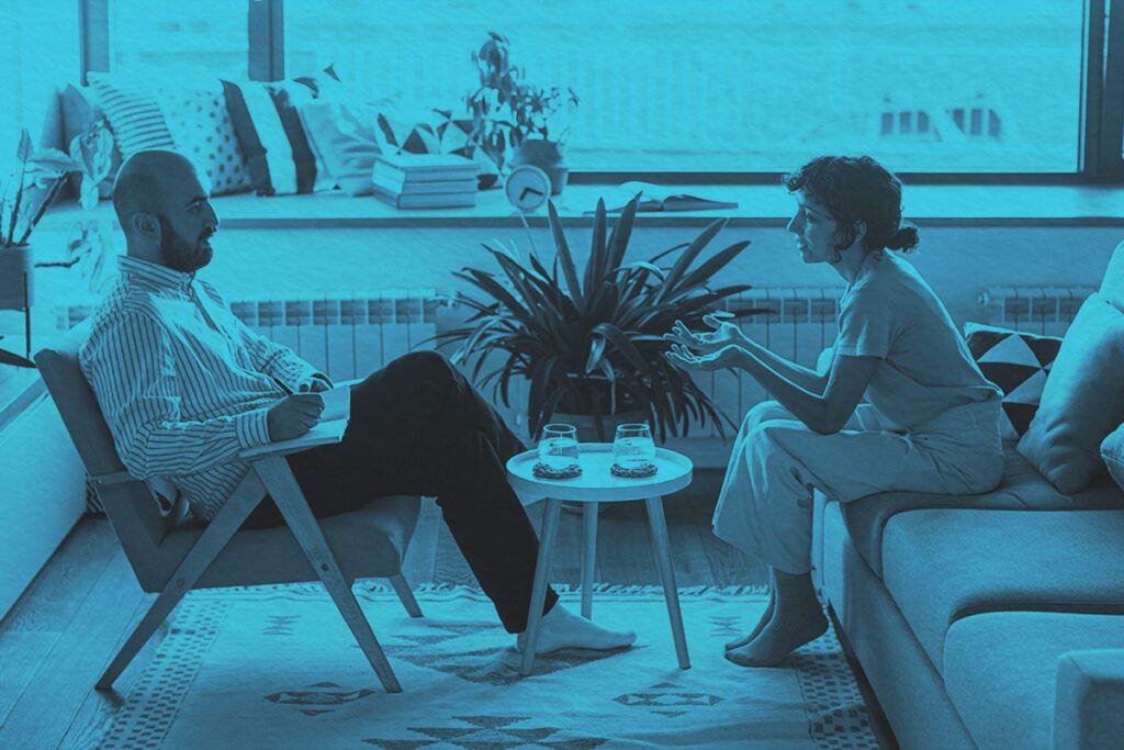 Therapist working with patient young woman in office