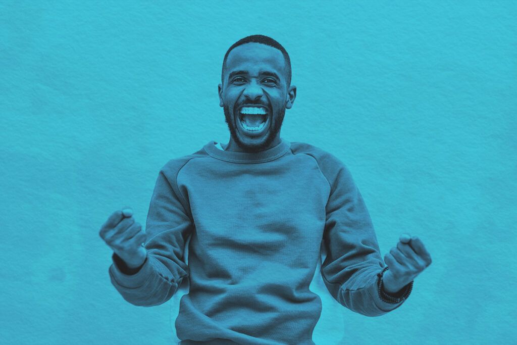 A joyful man with a beard expressing excitement