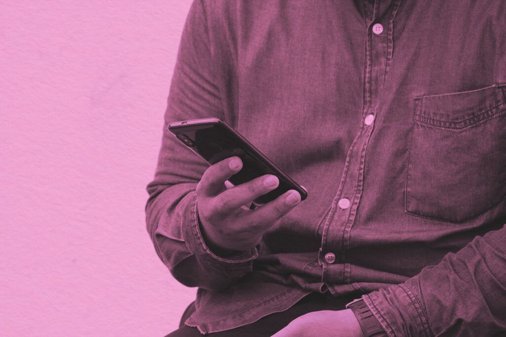 Close-up of a man holding smartphone