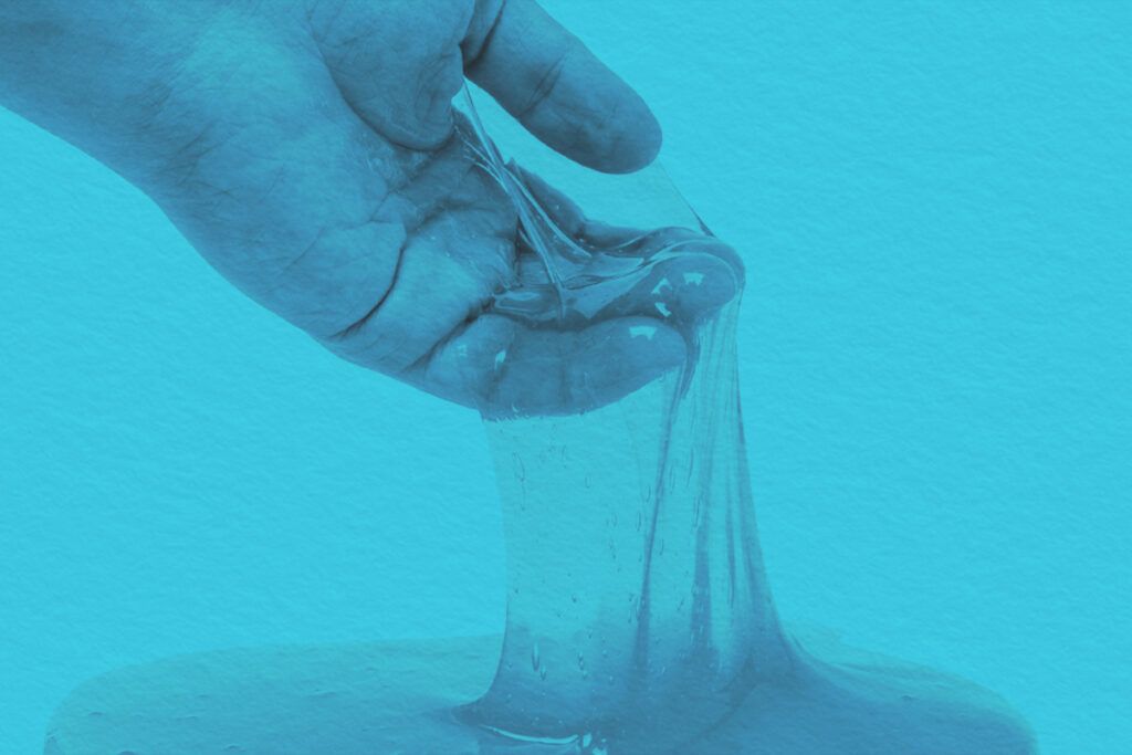 Close-up of slime oozing from a persons hand