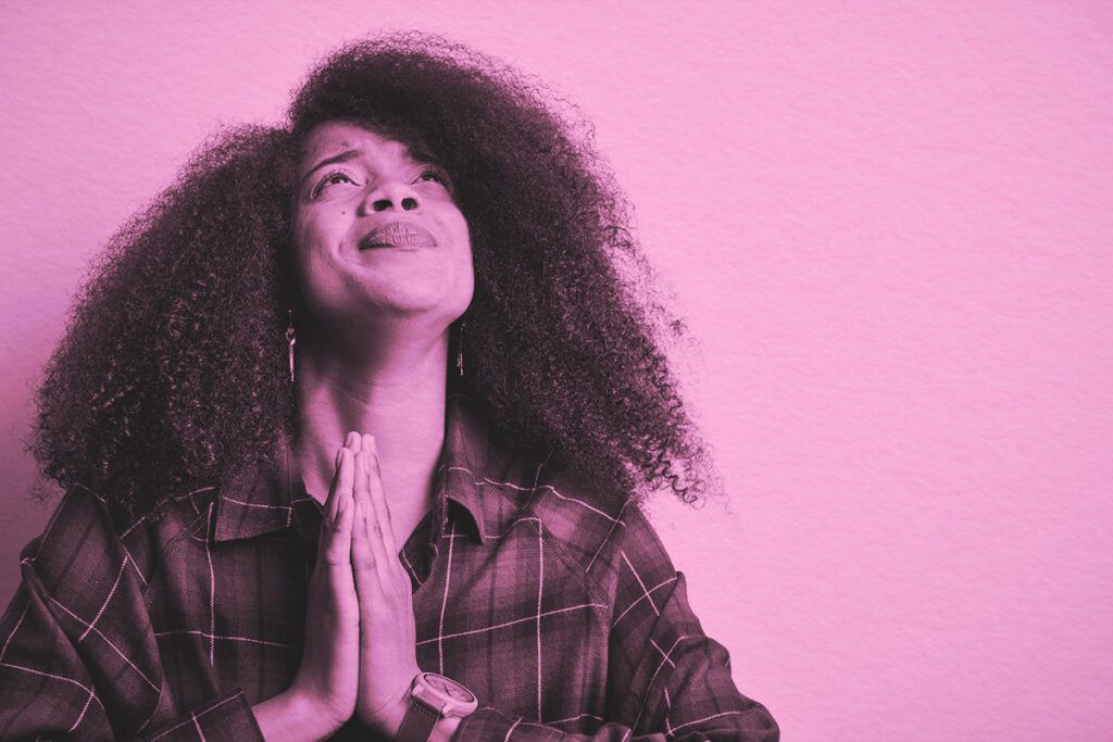 Woman begging and praying with hands together