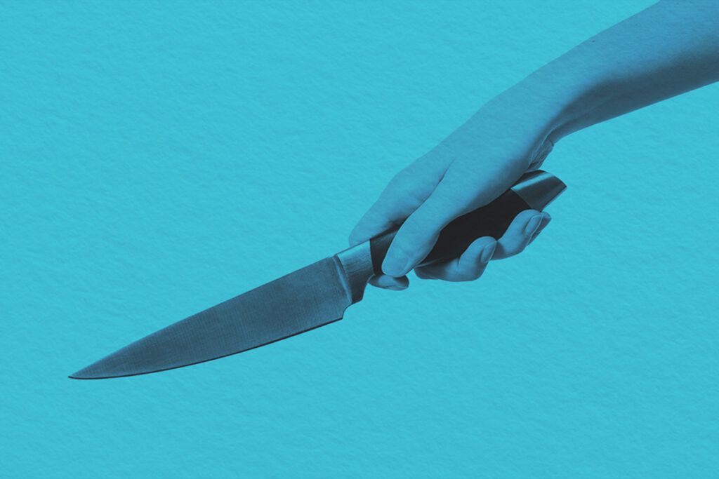 Hand horizontal holding kitchen knife