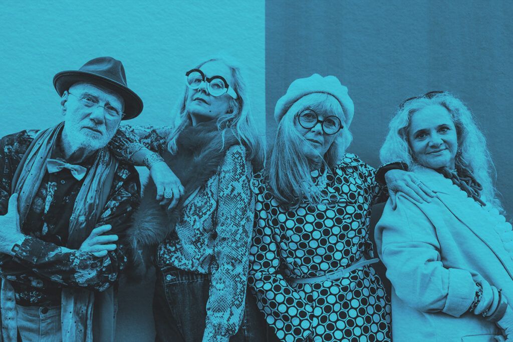 Group of baby boomers in unique fashion standing in front of wall