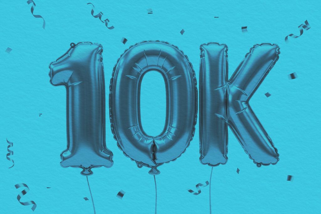 Foil balloon composition displaying a symbol celebrating ten thousand
